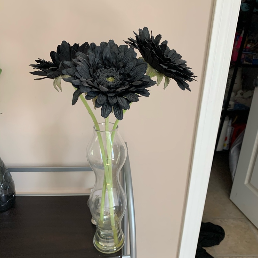 Faux flowers in glass vase